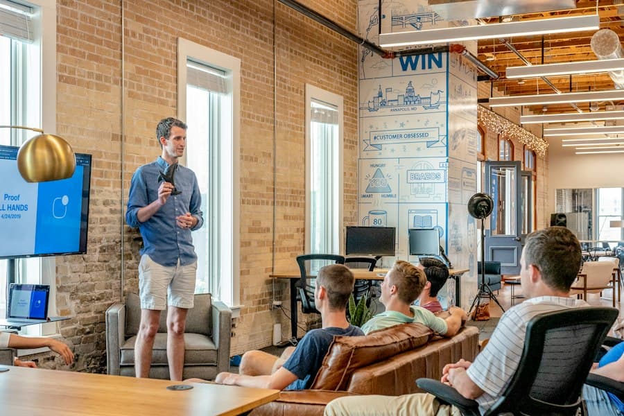 A presenter speaking to a small group in a workshop